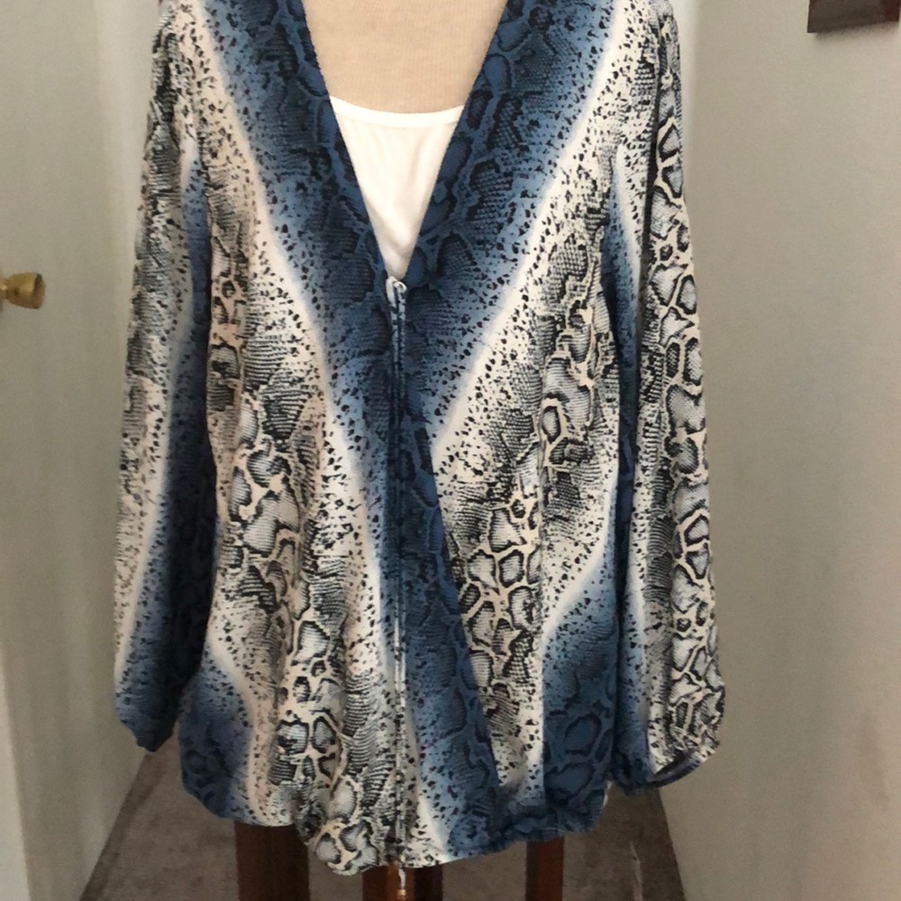 Women's blouse long sleeves elastic at wrists and hem has camisole attached